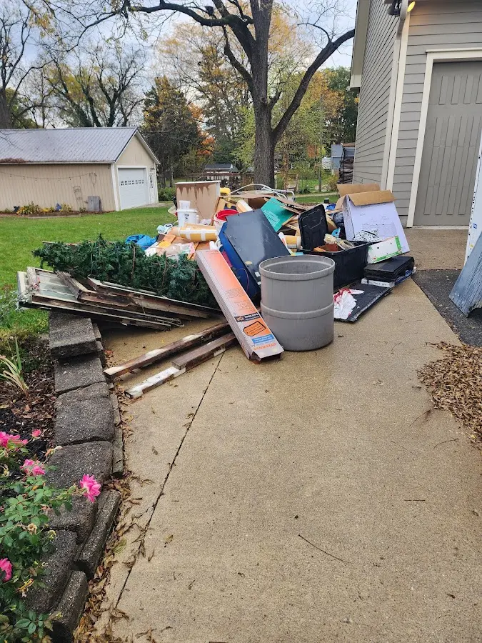 Dumpster being loaded with debris for Roofing Dumpster Rental in Mary Esther